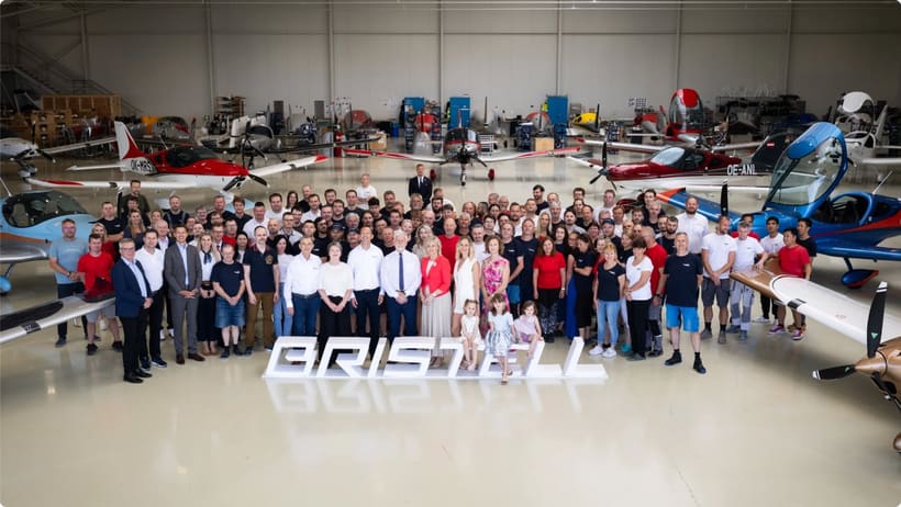 The BRM AERO team gathered in front of Bristell aircraft at the Kunovice factory