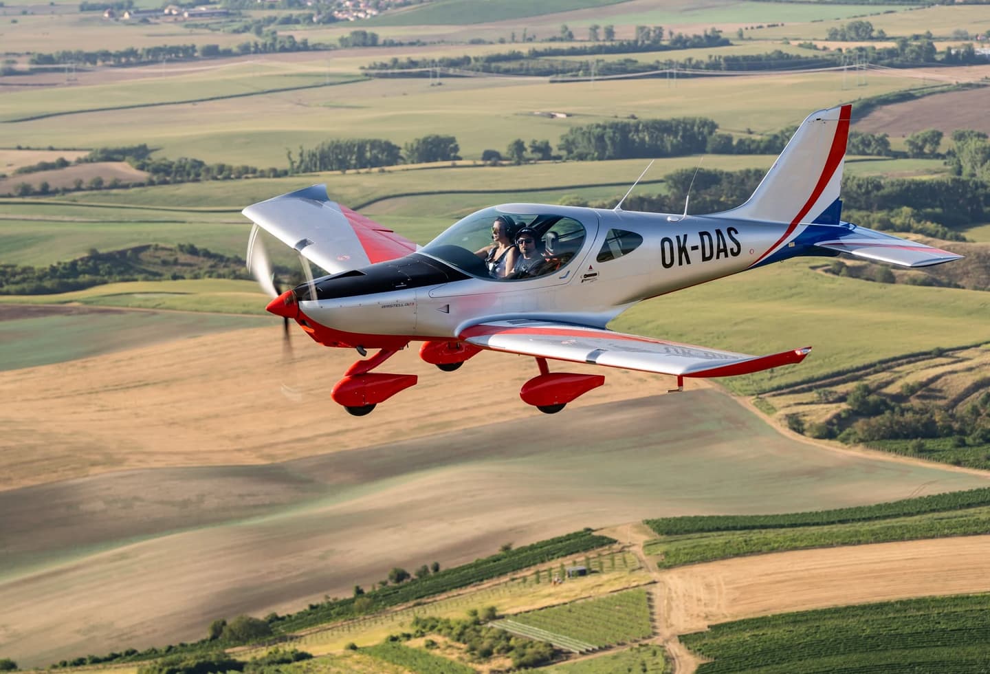 A Bristell B23 all-metal light aircraft in flight, the airframe behind the MOSAIC-ready B23M
