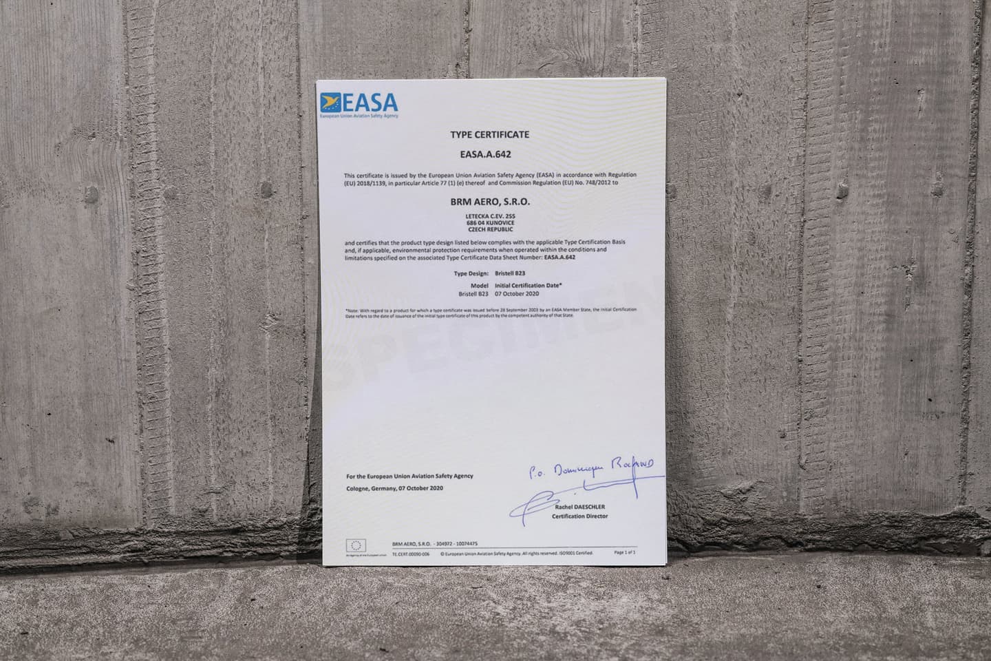 EASA type certificate EASA.A.642 for the Bristell B23, issued to BRM AERO in Kunovice, leaning against a concrete wall