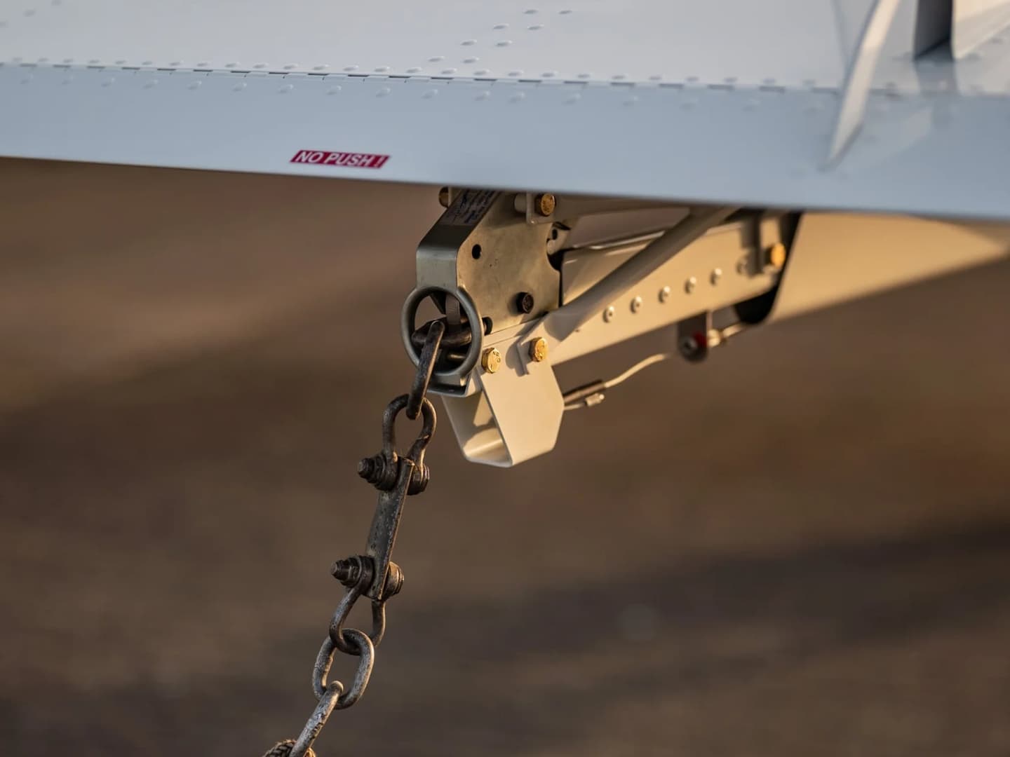 The factory tow release under the tail of a Bristell aircraft