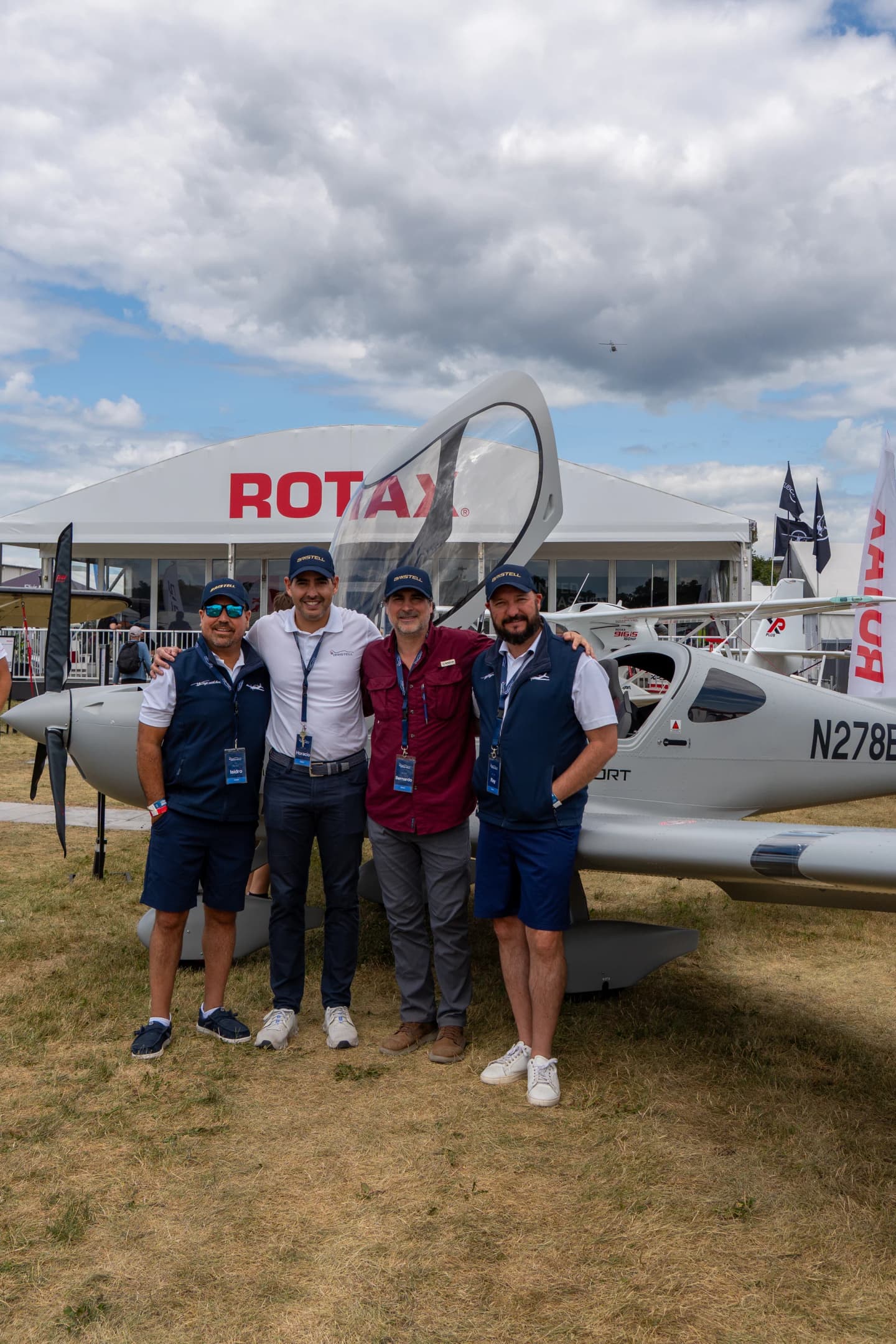 Bernardo Saviñon with the Bristell Aircraft Texas team in front of his Bristell Classic N278BS at the Rotax exhibit, EAA AirVenture Oshkosh 2026