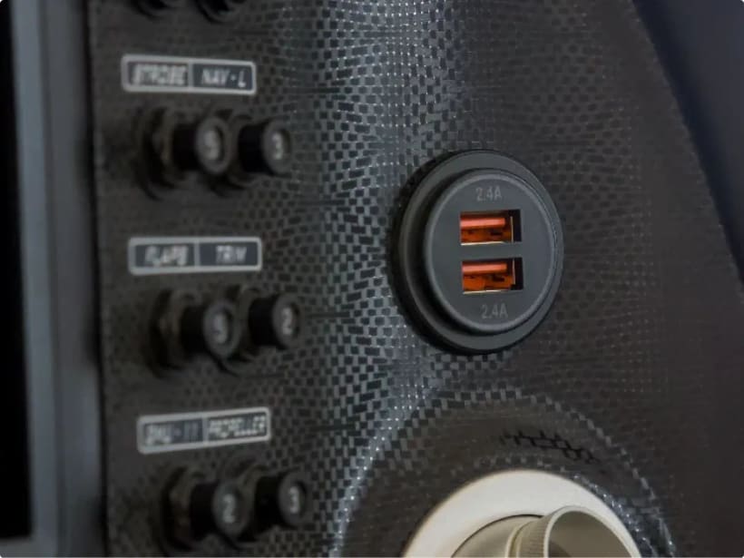 Dual USB charging ports built into a Bristell cockpit panel.