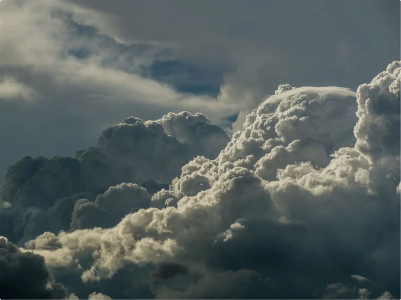 Towering clouds viewed from altitude, representing instrument-rated (IFR) flight.